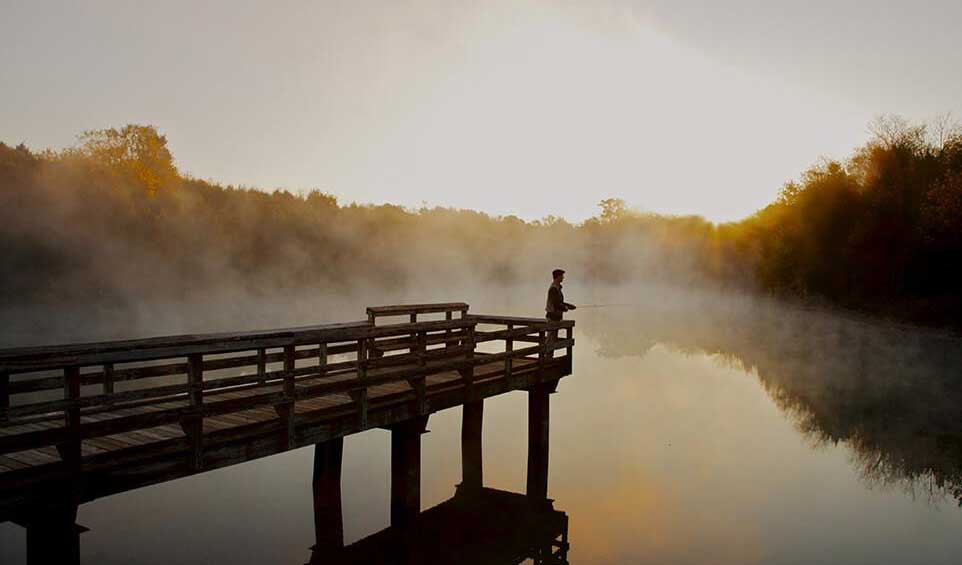 Man Fishing at a Pier in the 55+ community of Lake Frederick in Virginia
