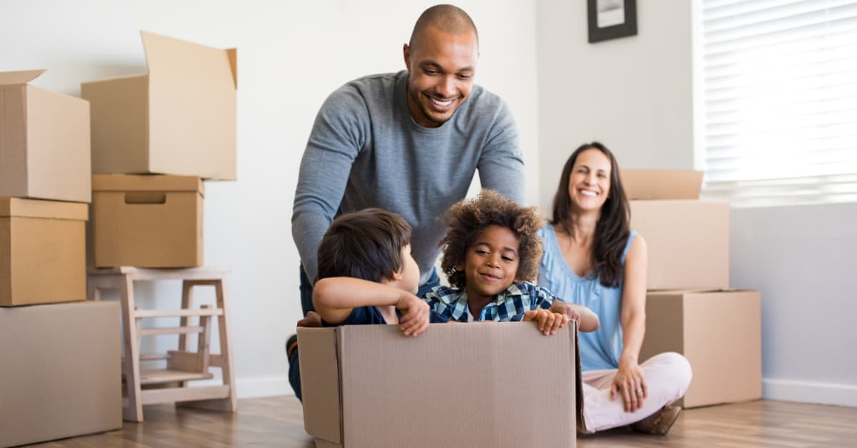 Couple and Children Moving into a New Home